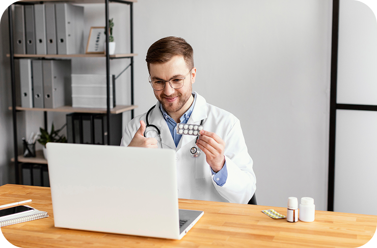 Doctor holding medication during online consultation for personalized treatments via laptop.